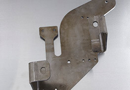 Single custom fabricated part with many bends and stamps